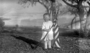 Child with American flag and gun inTexas